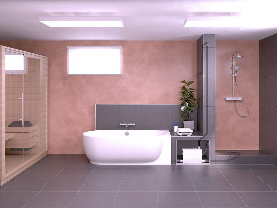 Schéma d'installation du petit poste de relevage Minilift M Sous-sol avec sauna, baignoire et douche. Les appareils sanitaires sont raccordés à un petit poste de relevage.